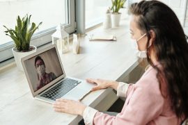 woman online meeting wearing a mask